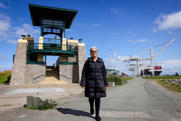 Former councilmember Nancy Nadel strolls past the Middle Harbor Shoreline Park's Chappell Hayes Observation Tower in Oakland, Calif., on Friday, March 28, 2025. The observation tower features a dedicated plaque for her late husband, Chappell Hayes. (Ray Chavez/Bay Area News Group)